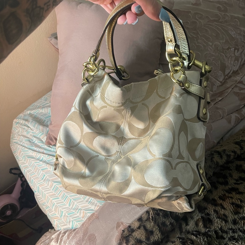 Gold coach bag